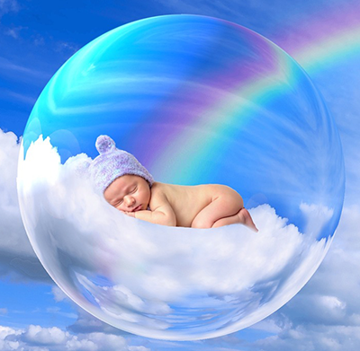 baby sleeping on rainbow cloud